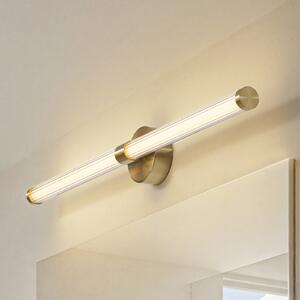 Lucande LED zidna svjetiljka Melisa, zlatna, 90 cm, CCT, IP44, Zlato / mjed, kupaonica, Staklo