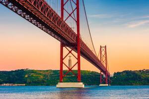 Fotografija 25th of April Bridge Lisbon Portugal at Sunset, © Allard Schager