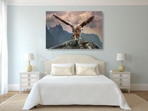 Slika orao raširenih krila iznad planina