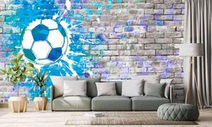Tapeta plava nogometna lopta na zidu od cigle