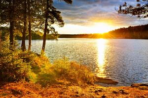 Fototapeta zalazak sunca iznad jezera