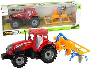 Crveni traktor s pogonom trenja grablja