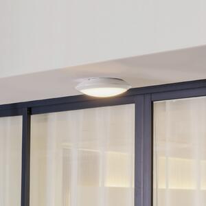 Lindby LED vanjska stropna svjetiljka Naira, bijela, senzor, 30 cm, IP65
