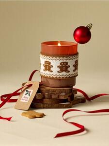 Sinsay - Božićna mirisna svijeća s navlakom s motivom medenjaka Gingerbread Cookies