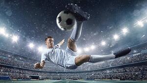 Umjetnička fotografija Soccer player kicking ball in stadium, Dmytro Aksonov, (40 x 22.5 cm)