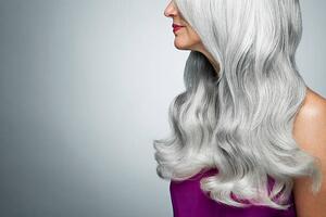 Umjetnička fotografija Cropped profile of a woman with long, gray hair., Andreas Kuehn, (40 x 26.7 cm)