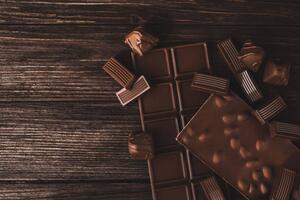 Fotografija Chocolate bars with nuts and candies close-up., Olena Ruban, (40 x 26.7 cm)