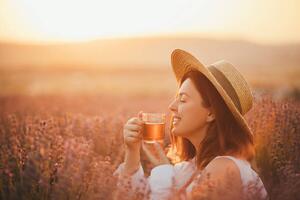 Fotografija Young happy woman drinking herbal tea,, Polina Lebed, (40 x 26.7 cm)