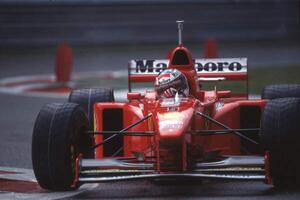 Fotografija Michael Schumacher in a Ferrari F310B at the Belgian GP, Spa Francorchamps, Belgium, 1997, (40 x 26.7 cm)
