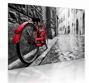 Staklena slika rdečega kolesa na tlakovani ulici (70x50 cm)
