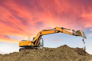 Ilustracija excavator in construction site on sunset sky, zhaojiankang