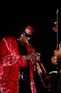 Fotografija Miles Davis, during a live performance, 1970-80