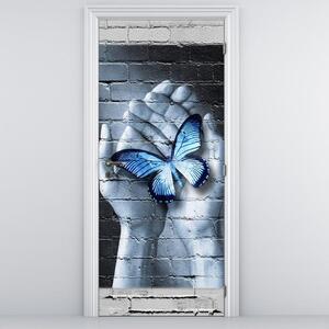 Foto tapeta za vrata - Plavi leptir na dlanovima (95x205cm)