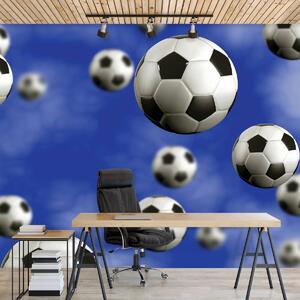 Foto tapeta - Nogometne lopte na plavoj pozadini (152,5x104 cm)