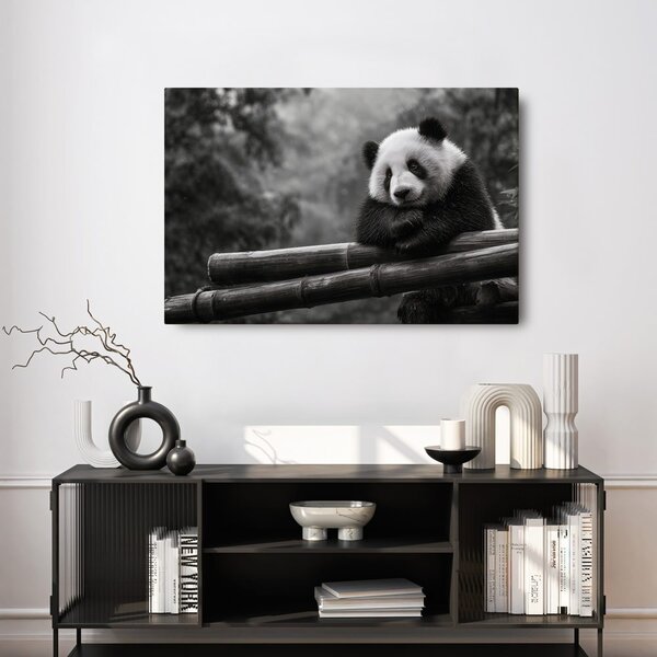 Slika panda odmara na bambusu