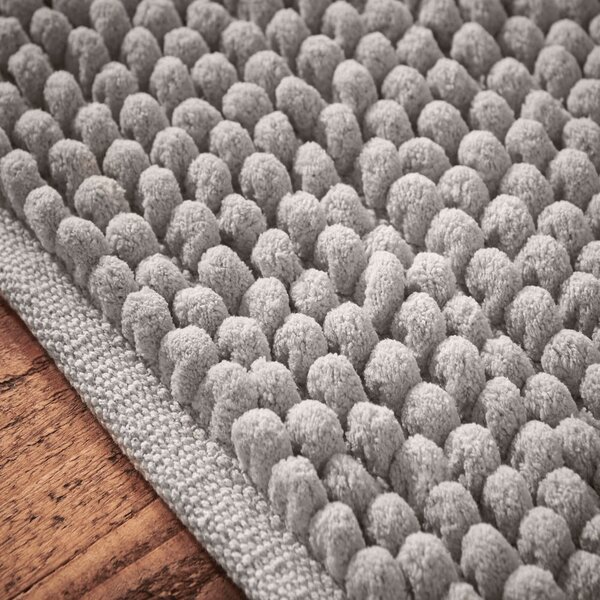 Siva kupaonska prostirka 50x120 cm Aspen Bobble – Bianca