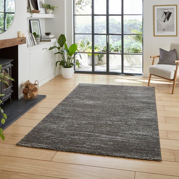 Tamno sivi periv tepih od recikliranih vlakna 120x170 cm Flores – Think Rugs