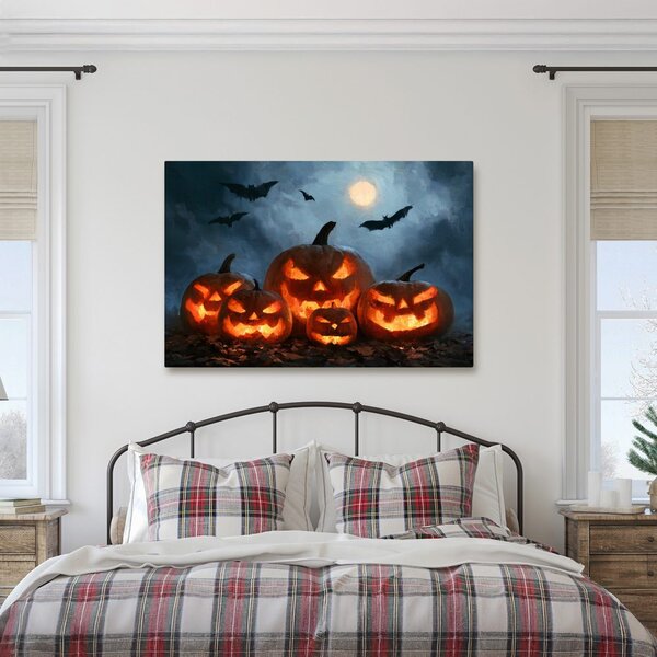 Slika halloweenske bundeve pod šišmišima