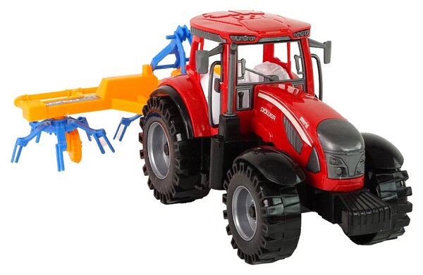 Crveni traktor s pogonom trenja grablja