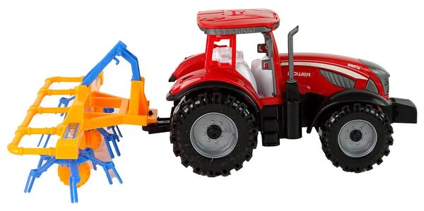 Crveni traktor s pogonom trenja grablja