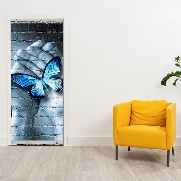 Foto tapeta za vrata - Plavi leptir na zidu (95x205cm)