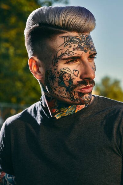 Fotografija Portrait of tattooed young man outdoors, Westend61, (26.7 x 40 cm)