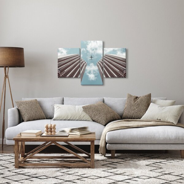 Slika aviona između zgrada (90x60 cm)