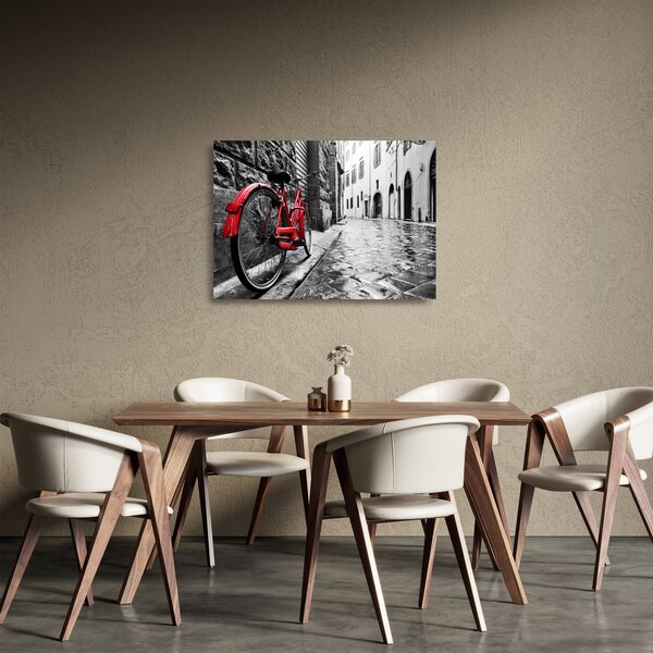 Staklena slika rdečega kolesa na tlakovani ulici (70x50 cm)