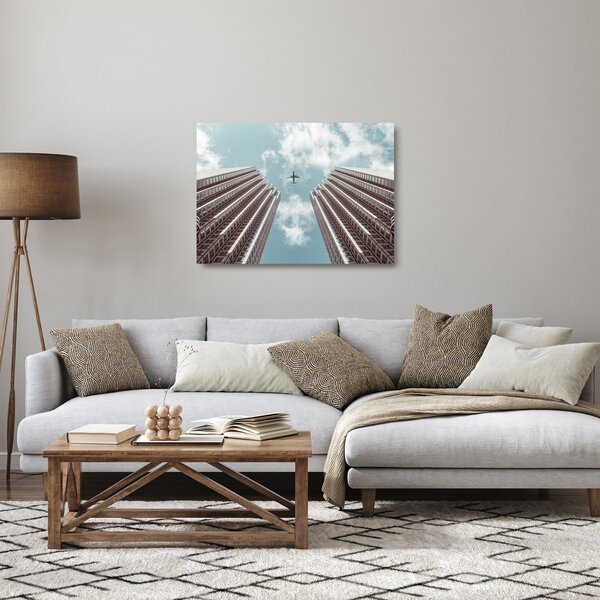 Staklena slika aviona između zgrada (70x50 cm)