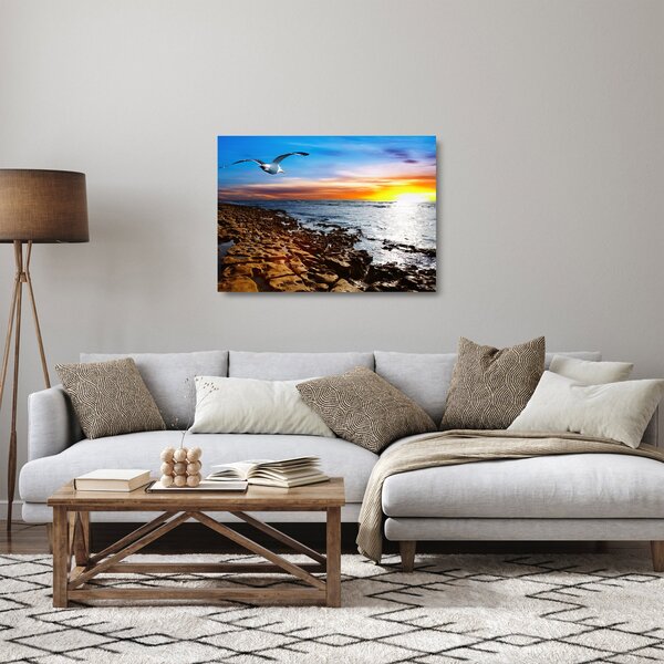 Staklena slika - Galeb leti iznad obale (70x50 cm)