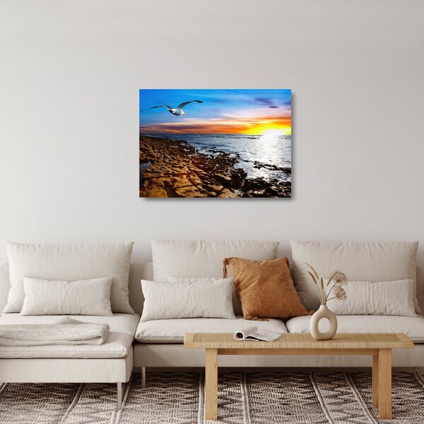 Staklena slika - Galeb leti iznad obale (70x50 cm)