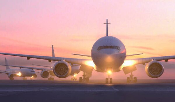 Ilustracija Airplanes taxiing on runway at sunset, Colin Anderson Productions pty ltd