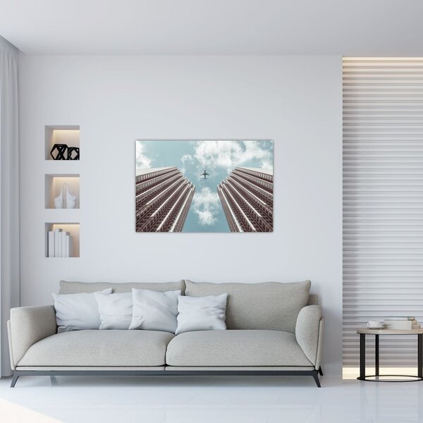 Slika aviona između zgrada (90x60 cm)