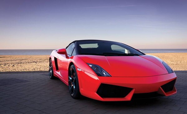 Foto tapeta - Crveni automobil (152,5x104 cm)