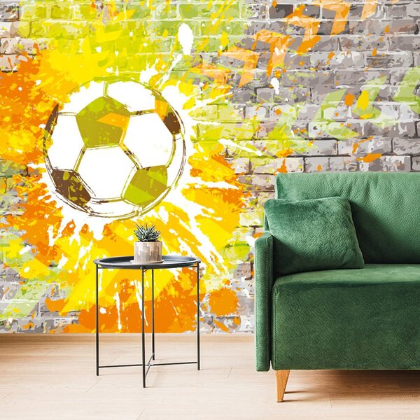 Tapeta nogometna lopta na zidu od cigle